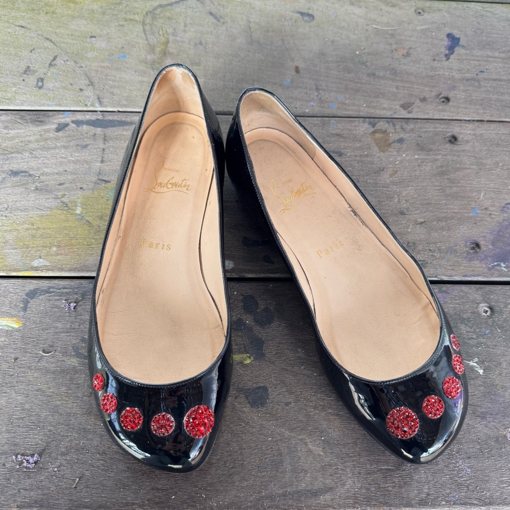 Christian Louboutin Black Flats with Red Embellishments